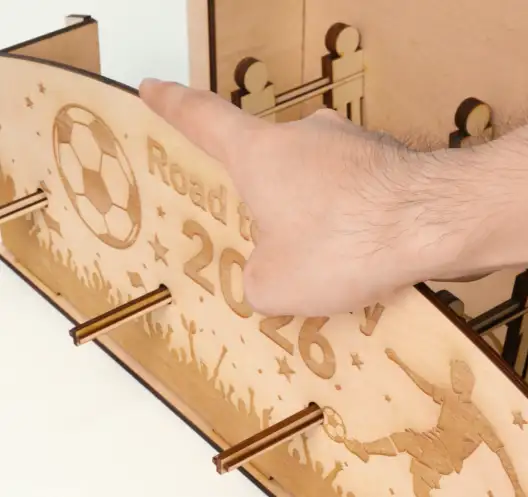 assemble the wooden table football.webp