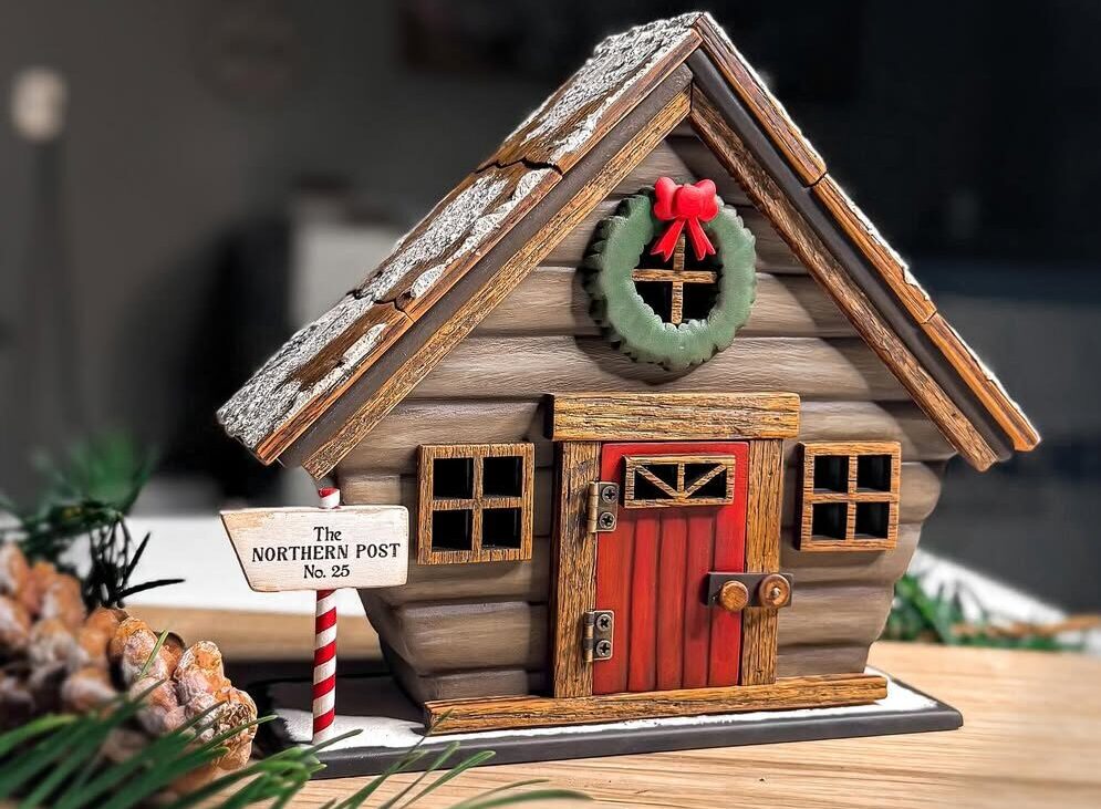 Laser cut wooden Christmas house model kit made with a Thunder Laser machine