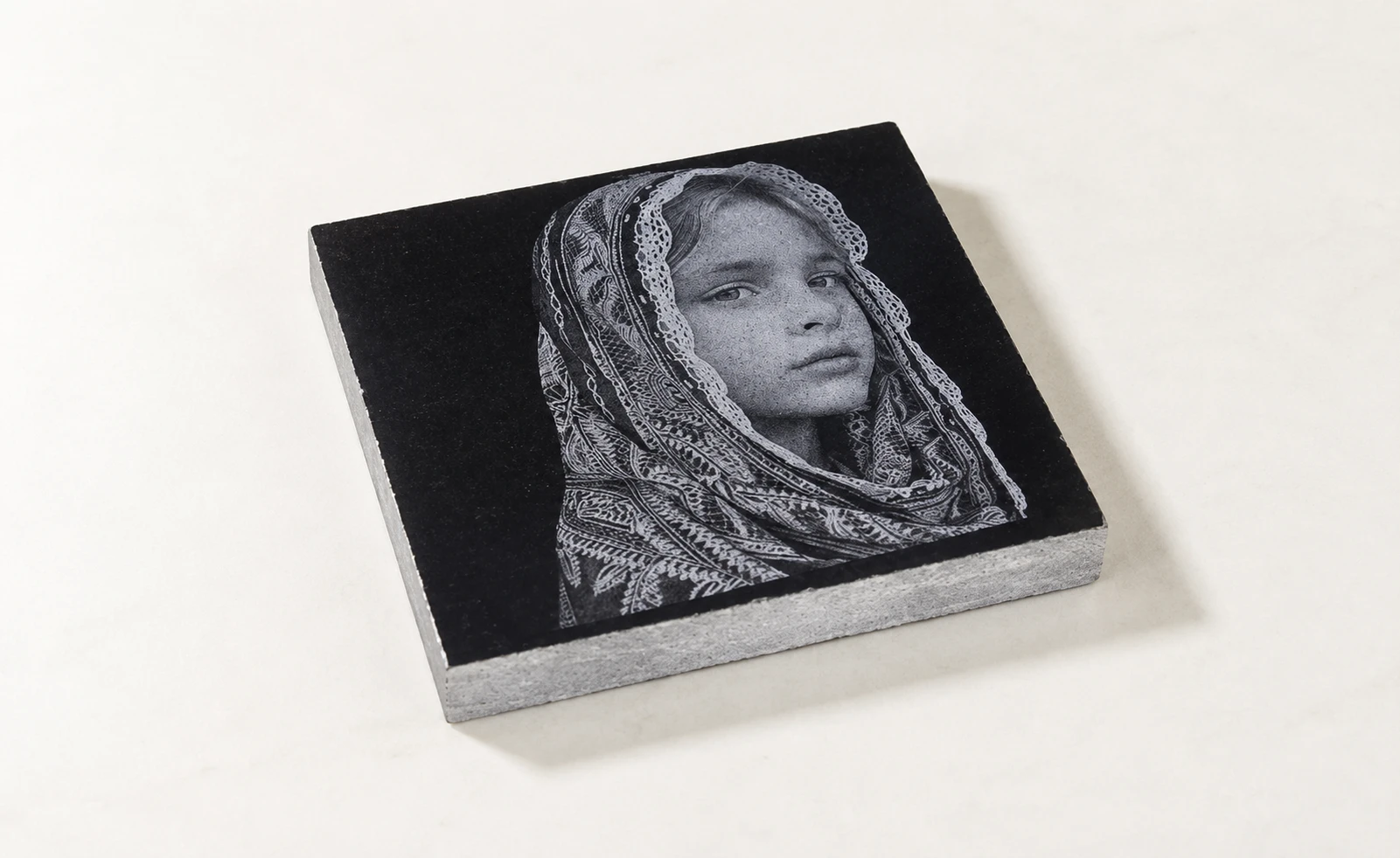 laser engraved girl's pic on marble with CO₂ laser.